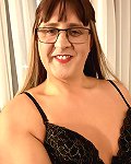 A beautiful shemale is having fun in front of a camera all alone